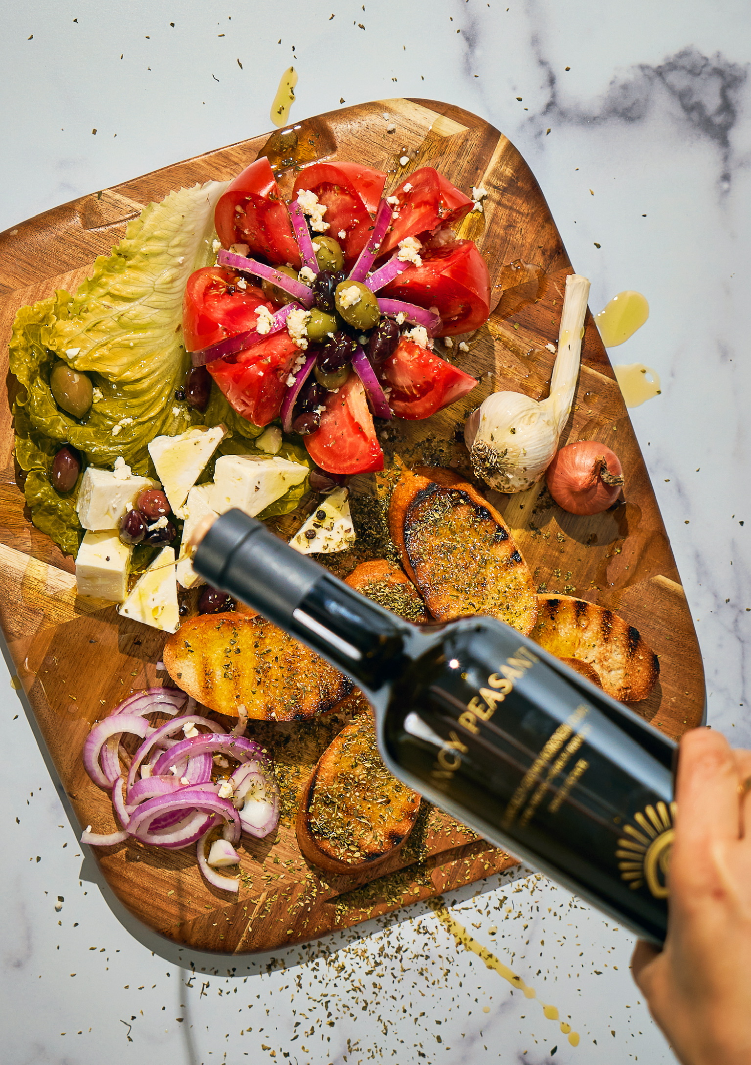 Fancy Peasant Greek salad board with olive oil